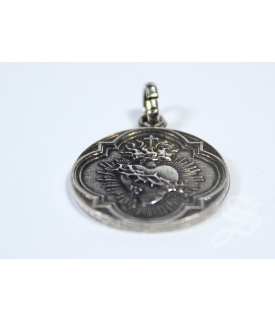 MEDALLA DETENTE  CORAZON DE JESUS 20 MM. BAÑO PLATA 5 MIC.